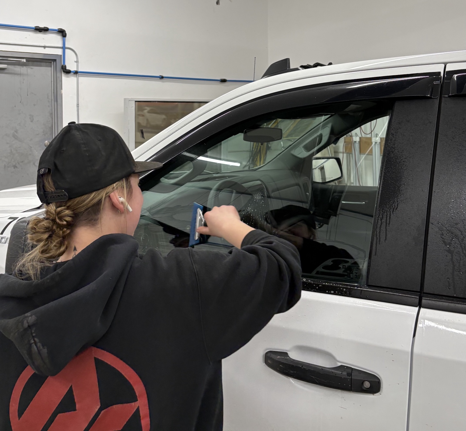 AUTO RECON 360 technician installing automotive window tint